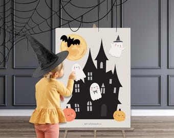 May include: A Halloween-themed poster featuring a black haunted house, a full moon, a bat, and friendly ghosts. Two orange pumpkins are at the bottom. A child wearing a witch hat interacts with the poster. The poster is on an easel.