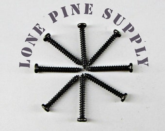 May include: A close-up of eight black screws arranged in a star shape on a white surface. The text "LONE PINE SUPPLY" is printed in gray around the screws.