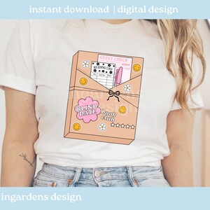 May include: White t-shirt featuring a graphic of a book club envelope with the text "BLIND DATE book club". The envelope design includes a reading list, guest check, smiley faces, and flower graphics. The words "instant download | digital design" are at the top.