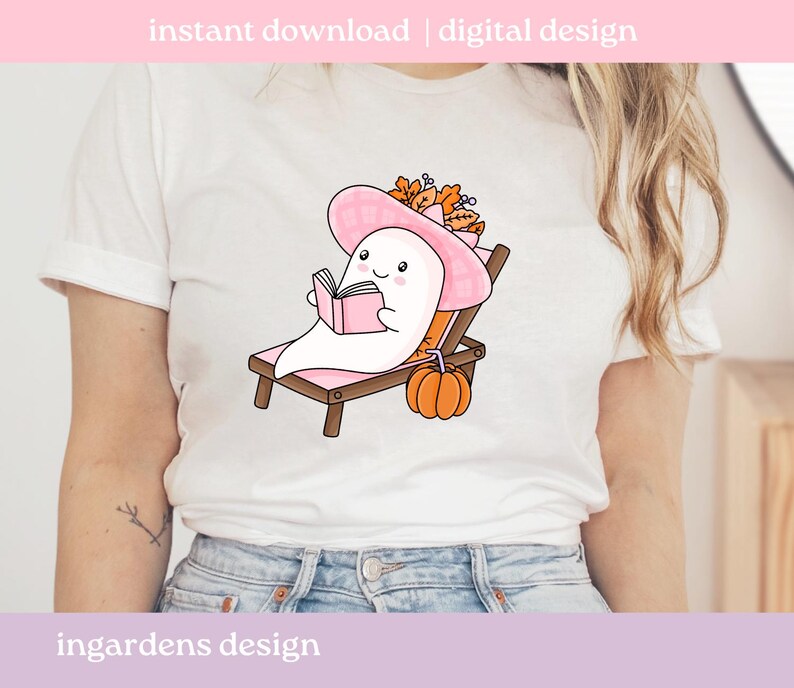 May include: White t-shirt featuring a cartoon ghost wearing a pink hat and reading a book while relaxing on a beach chair. A small orange pumpkin sits nearby. The text "instant download | digital design" is at the top.
