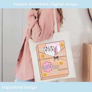 May include: A cream-colored tote bag featuring a graphic of a book club box with the text "Blind Date Book Club." The design includes a guest check, reading list, smiley faces, and flower details. The words "instant download | digital design" are at the top.