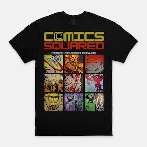 May include: Black t-shirt with the text "COMICS SQUARED" in yellow and red. The shirt features a grid of nine comic book panels with various characters and designs. The phrase "COMIC COVERED CANVAS" is below the main text.