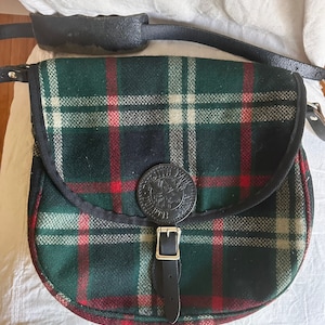 Vintage Duluth pack bag crossbody messenger wool plaid green red white black leather shoulder strap logo buckle medium size rare color