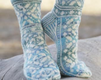 Hand knit socks. Wool socks. Bed socks. House socks. Girl and woman.