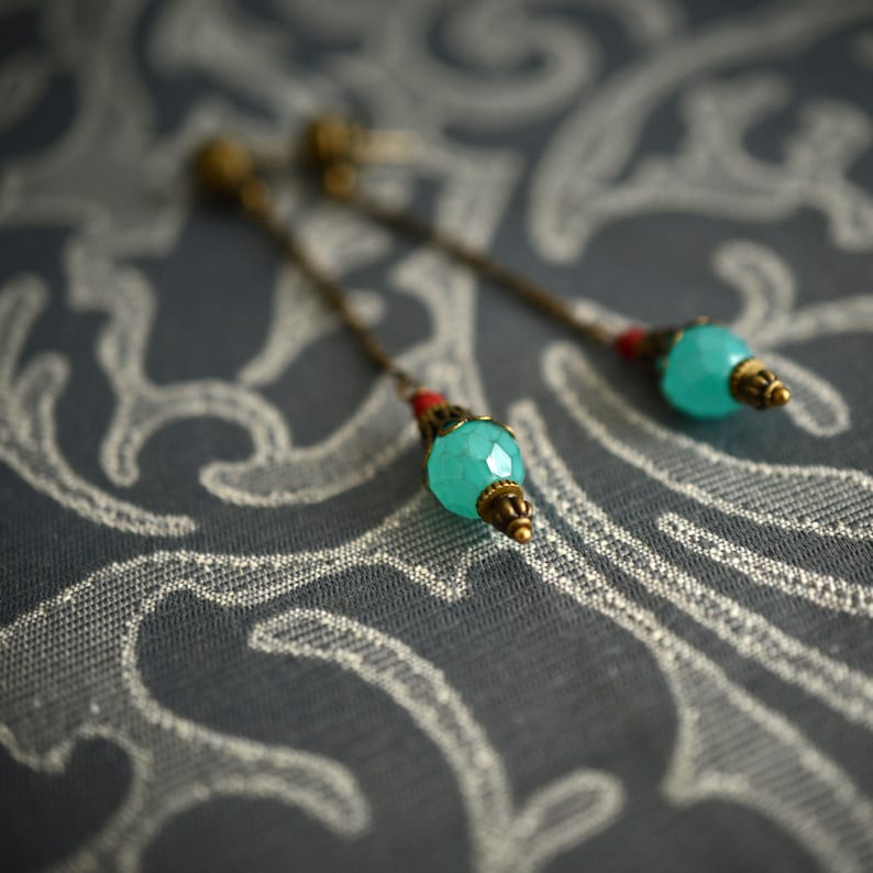 Orisha Blue and red glass and brass ear pendants