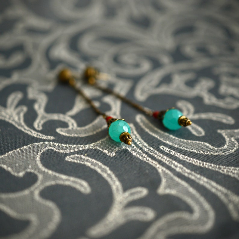 Orisha Blue and red glass and brass ear pendants
