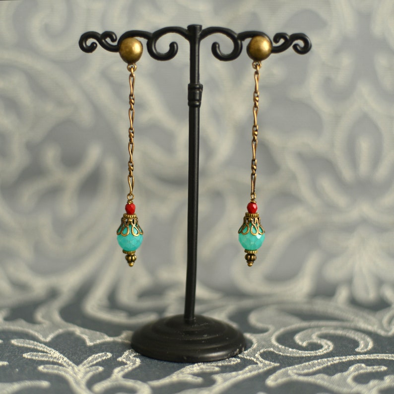 Orisha Blue and red glass and brass ear pendants