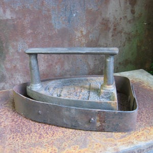 Antique VICTORIAN FLAT IRON 'Le Parisien' and base. Rare French sad hand iron and blacksmith made rustic trivet. image 1