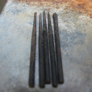 May include: A set of three ceramic nesting bowls in shades of blue, green, and white. The bowls feature a speckled glaze and a simple, modern design. The largest bowl is approximately 6 inches in diameter.