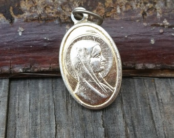 Vintage SERENE VIRGIN MARY and St Bernadette Soubirous, our Lady of Lourdes gold pendant. French catholic two sided religious medal.