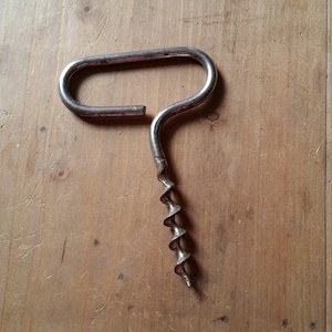 1960s FRENCH VINTAGE CORKSCREW made from one single metal bar with a bladed helix. C shape clean and minimal design bottle opener.