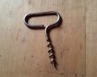 1960s FRENCH VINTAGE CORKSCREW made from one single metal bar with a bladed helix. C shape clean and minimal design bottle opener.