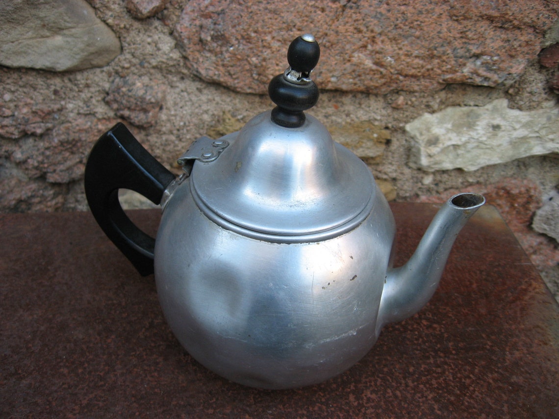 Vintage TEAPOT with STRAINER Priscilla ware. The basket is Etsy