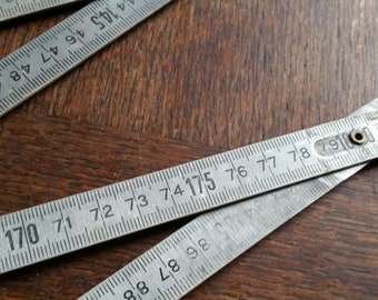 Vintage 2 METER FOLDING RULER, concertina style. Metal metric tape measure workshop tool from France.