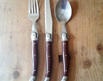 Vintage LAGUIOLE FRENCH CUTLERY set of knife, fork and spoon with classic handles and famous bee symbol. Fun foodie gift from France.