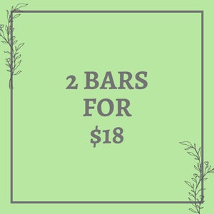 May include: A green background with a white border and floral accents. The text "2 BARS FOR $18" is displayed in gray.
