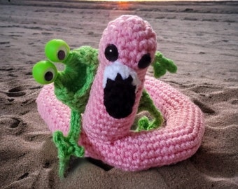 Mini frog with pink flamingo float