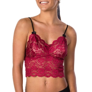 May include: A red lace bralette with black straps and a bow detail. The bralette is made of a delicate, sheer lace fabric.