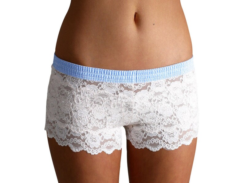 May include: White lace underwear with a light blue elastic waistband.