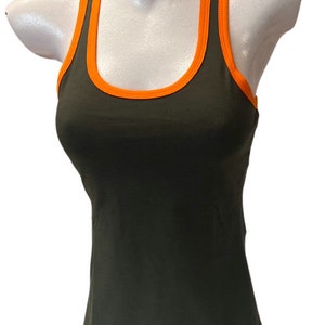 May include: A dark green tank top with orange trim around the neckline and armholes. The tank top has a small orange bow on the bottom right side.