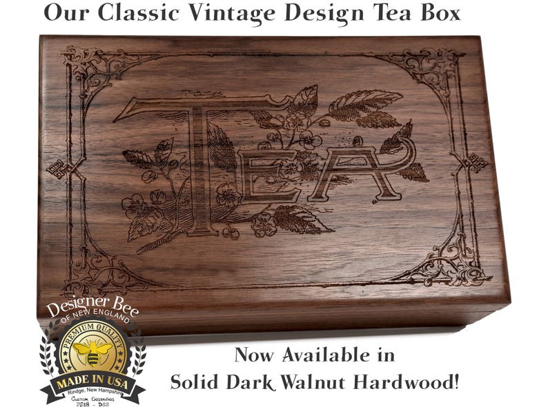 May include: A dark walnut wood tea box with an engraved design of the word "TEA" surrounded by leaves and flowers. The box has a classic vintage design and is made in the USA by Designer Bee of New England.