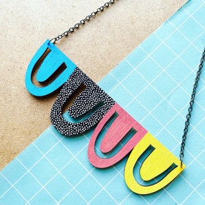 Rainbow statement arch dot pattern necklace