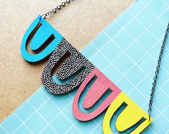 Rainbow statement arch dot pattern necklace