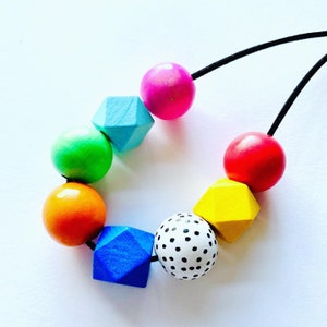 Geometric chunky beaded, minimal style wooden statement necklace in rainbow colours