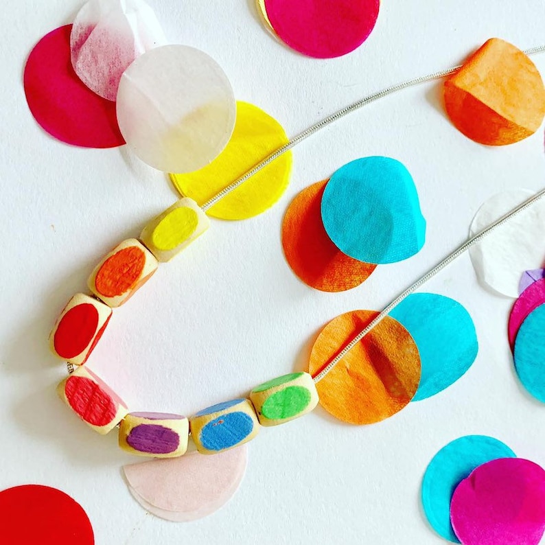 minimal style wooden statement necklace in rainbow colours. Geometric bead