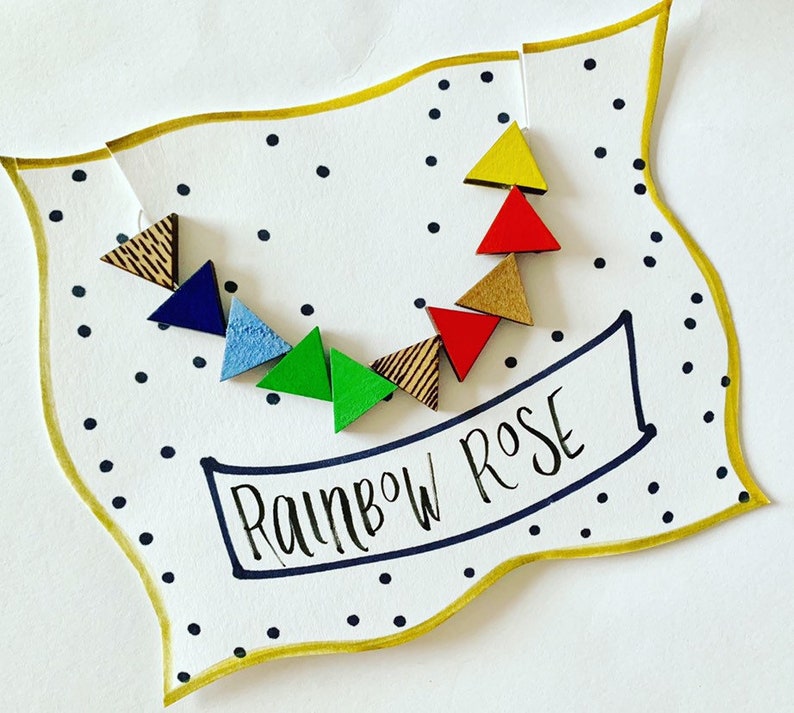 minimal style wooden statement necklace in rainbow colours. Geometric bead