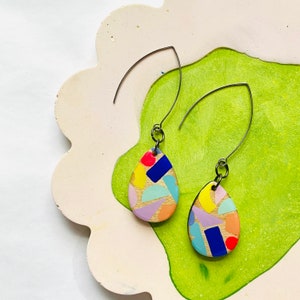 Bold colourful geometric pattern teardrop shape earrings with resin dome