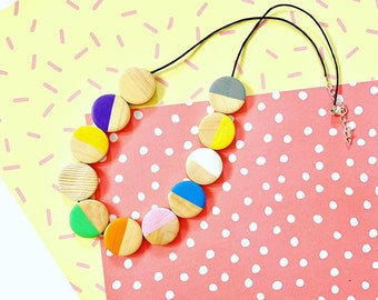 Geometric flat circle bead, minimal style wooden statement necklace in rainbow colours.