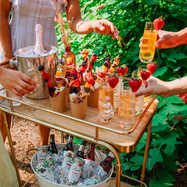 Custom Name Detail on Champagne Flute in a bridal shower setting– select Your Desired Font and Color to make the perfect bridal shower gift.