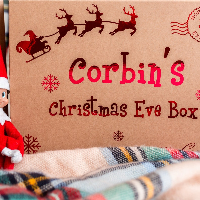 zoomed in shot of our christmas eve themed gift  box with child's name and from the recipient, Santa. Stamped north pole express.