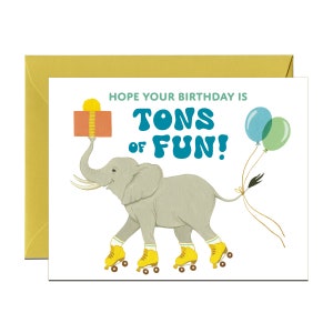 May include: A birthday card featuring a gray elephant wearing roller skates and carrying a gift box. The card has the text "Hope your birthday is tons of fun!" in blue and green lettering.