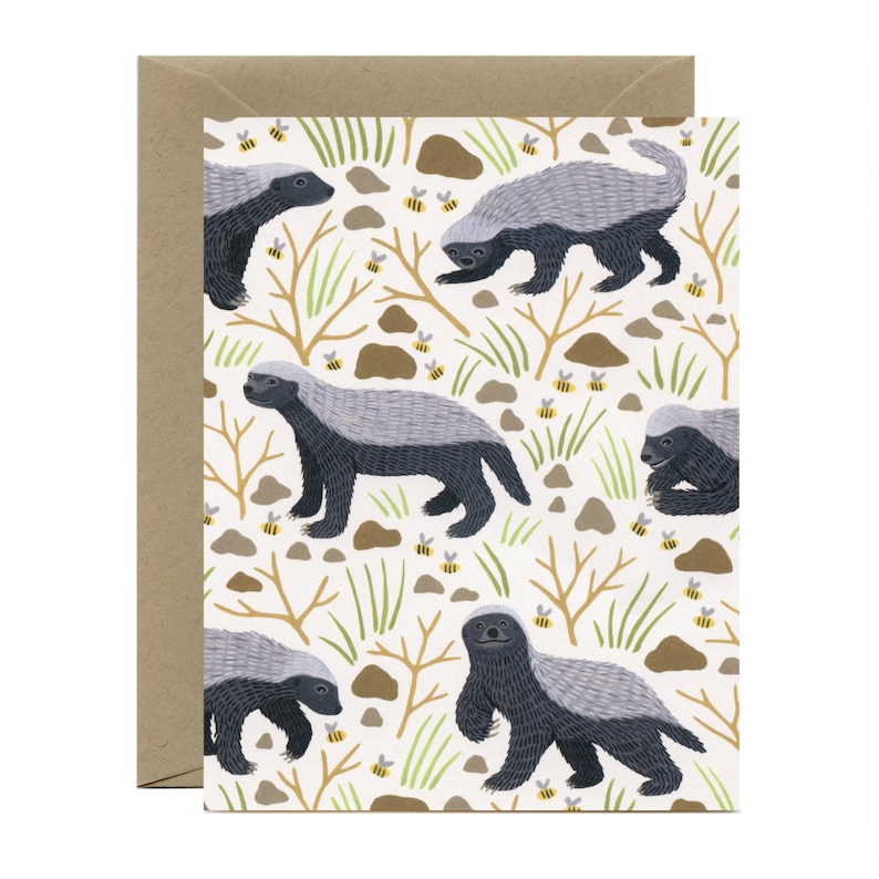 May include: A white card with a repeating pattern of honey badgers and bees. The honey badgers are gray and black with white stripes. The bees are yellow and black. The background is white with brown branches and green grass.