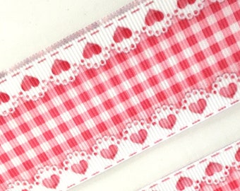 May include: Red and white gingham ribbon with a white lace trim and a heart pattern.