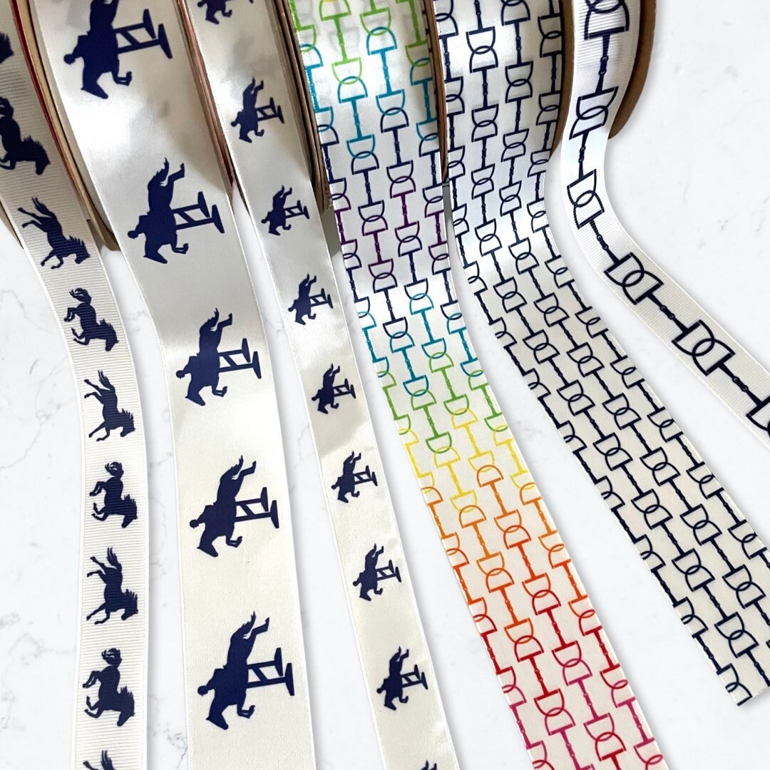 Equestrian themed snaffle bit pattern ribbon in black printed on