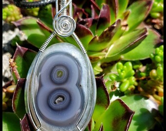 Double Solar Quartz Also Known as a Shiva's Eye Hand Wrapped in 925 Sterling Silver with an 18" Black Corded Necklace. Wanderlust Amulet