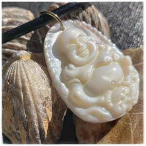 Soft Lustre Filled Mother of Pearl Shell, Carved Buddha,  with an 18" Black Cord Necklace. Peace Filled Zen Amulet