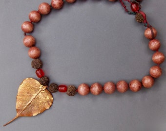 Copper Bhodi Leaf Necklace: Rosewood Beads, Rudraksha Seeds, Red Amber