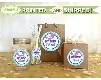 May include: Round stickers with a mermaid design and the text "Happy Birthday Sarah" in purple and teal on a blue and white background.