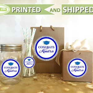 May include: Graduation party favor labels with a blue graduation cap and the text "Congrats Kendra" on a silver glitter background.