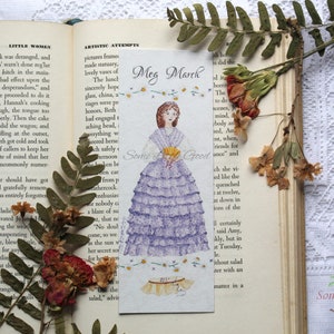 May include: A purple and white bookmark with a hand-painted illustration of a woman in a purple dress. The bookmark features the text "Meg March" and "Some Little Good".