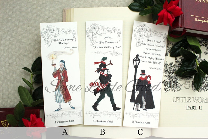 Pode incluir: Tr&ecirc;s marcadores de p&aacute;gina com ilustra&ccedil;&otilde;es e cita&ccedil;&otilde;es de A Christmas Carol de Charles Dickens. O primeiro marcador de p&aacute;gina mostra Scrooge com uma vela, o segundo mostra Tiny Tim e o terceiro mostra um casal caminhando na neve.