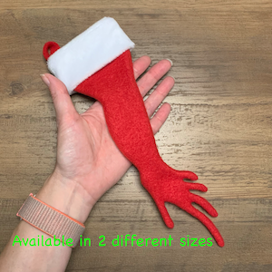 May include: Red felt Christmas stocking with a white faux fur cuff. Available in two different sizes.