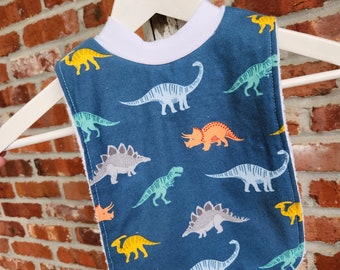 Infant or Toddler Pull Over Bib (Flannel and Terry Cloth) - Dinosaurs on Blue