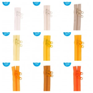 May include: Nine different colors of zipper tape, each with a label indicating the color name. The zipper tape is 55 cm long and has two pull tabs.