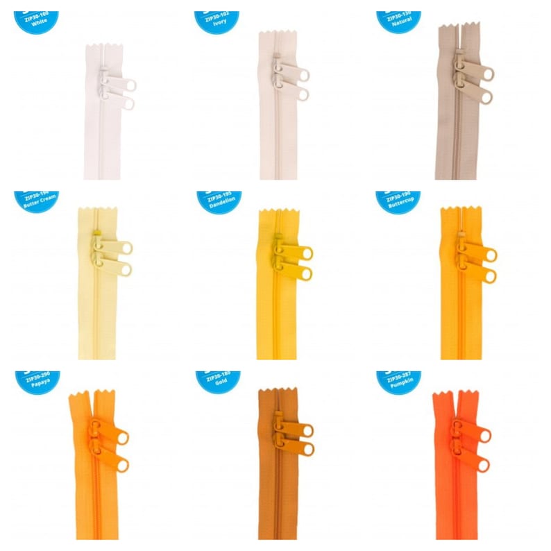May include: Nine different colors of zipper tape, each with a label indicating the color name. The zipper tape is 55 cm long and has two pull tabs.