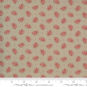 May include: A beige fabric with a repeating pattern of small pink floral bouquets and tiny white dots. The fabric is measured with a ruler in inches.